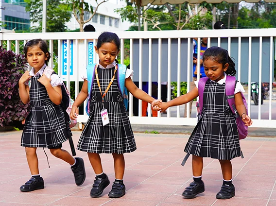 NHIS students walking hand in hand on campus