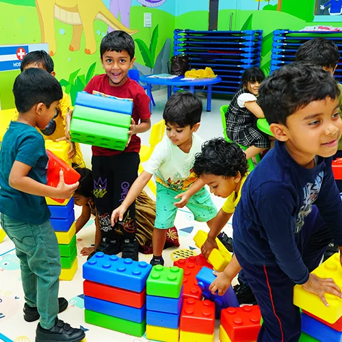 Playgroup children building with blocks at NHIS