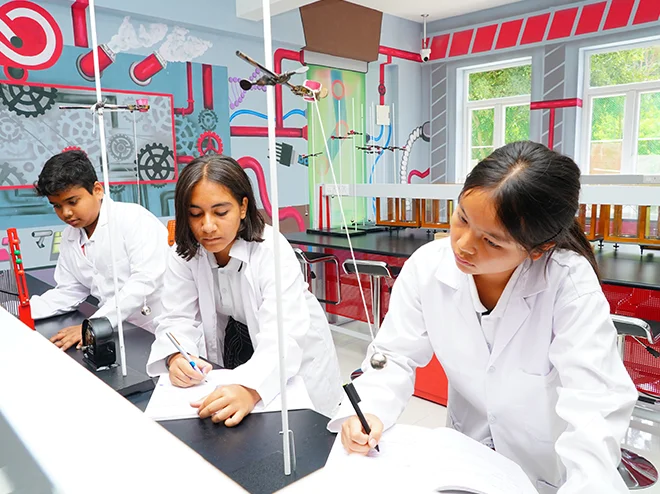 Secondary students conducting a lab experiment