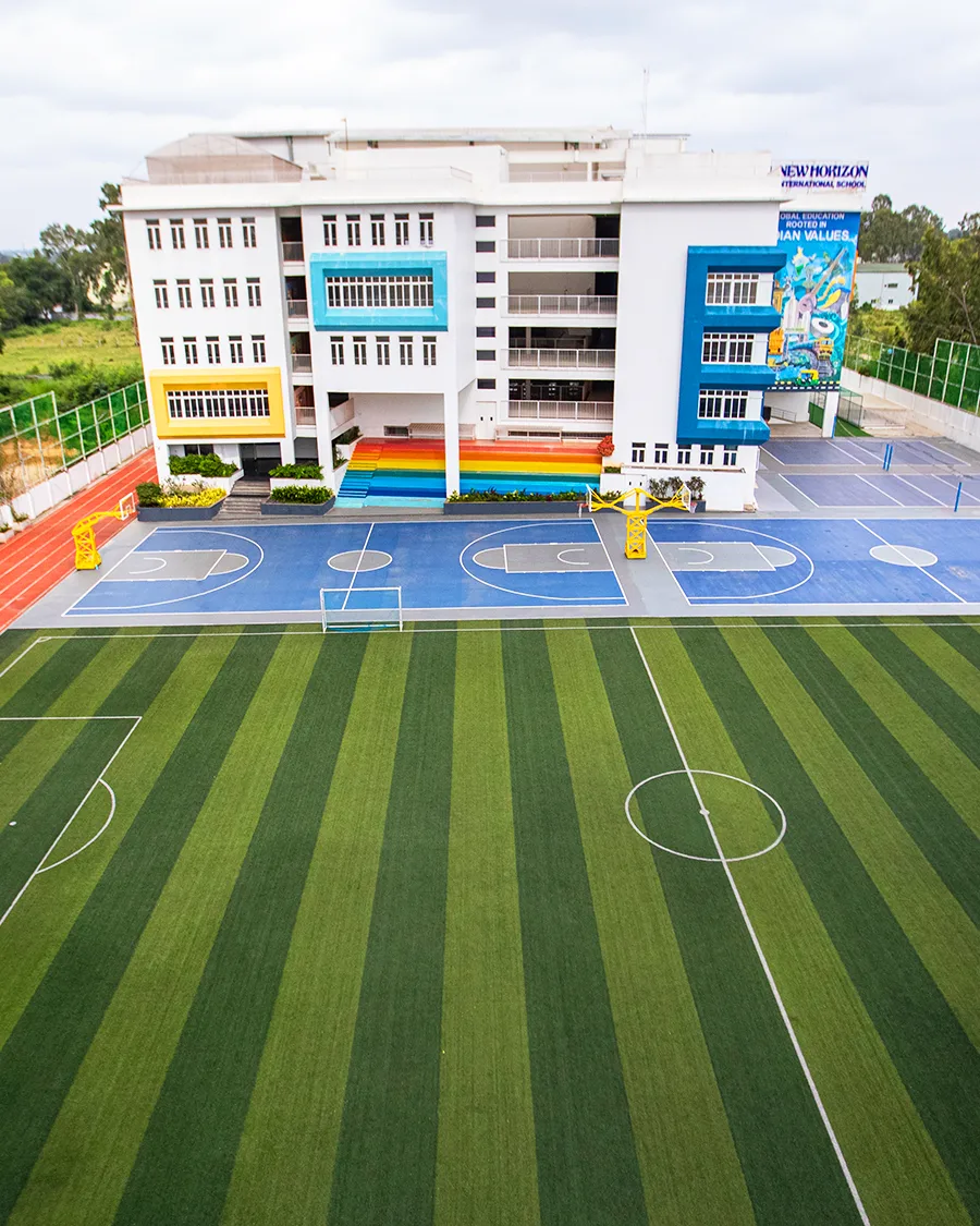 NHIS sports field and campus facade