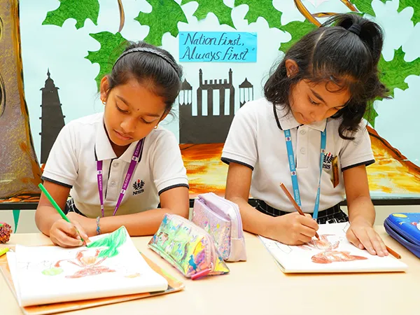 Students drawing and colouring in class
