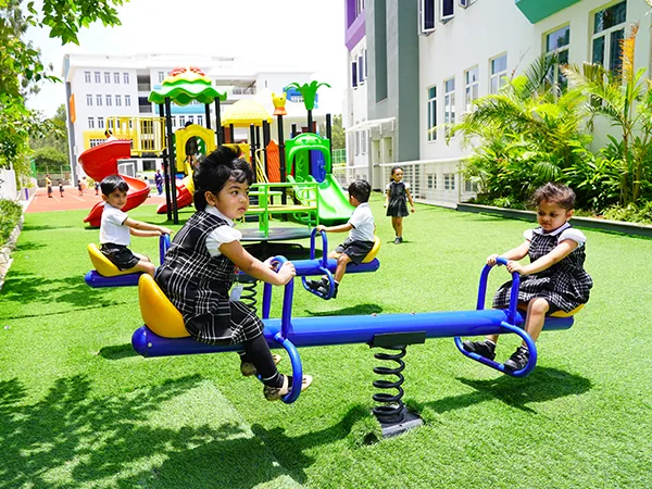 Young learners playing in the NHIS playground