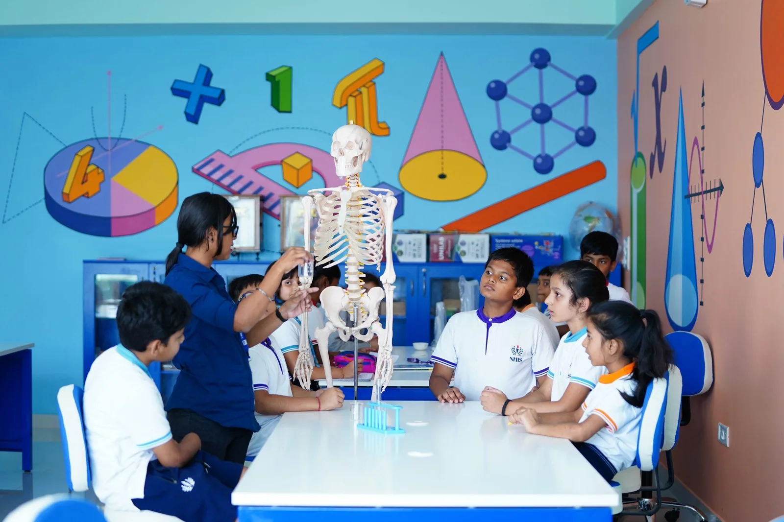 NHIS students conducting an experiment in the science laboratory