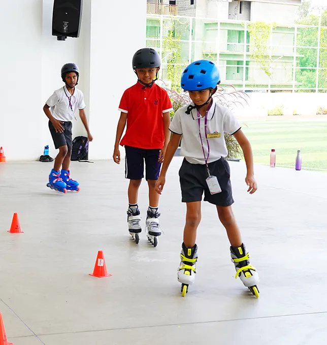 Children skating through cones during PE