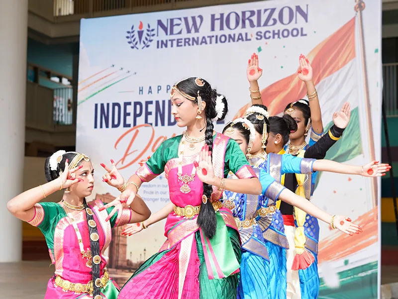 Students performing a classical dance at an NHIS celebration